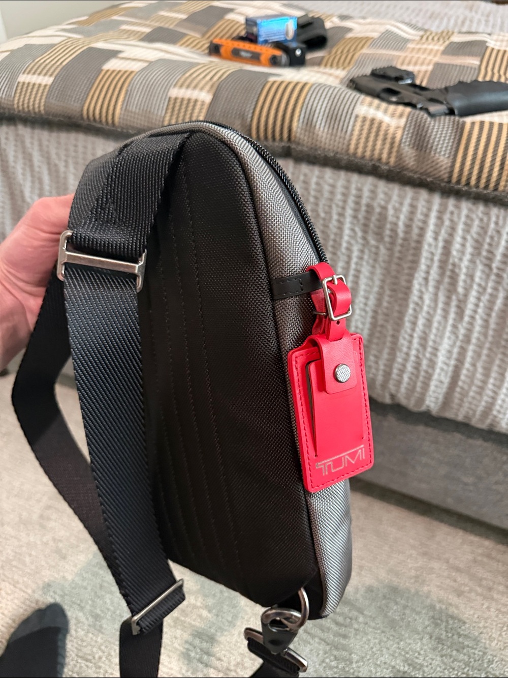 Tumi Gray Sling Bag with Red Accent- NEVER USED OR WORN. Tags removed, A gift - Picture 5 of 9